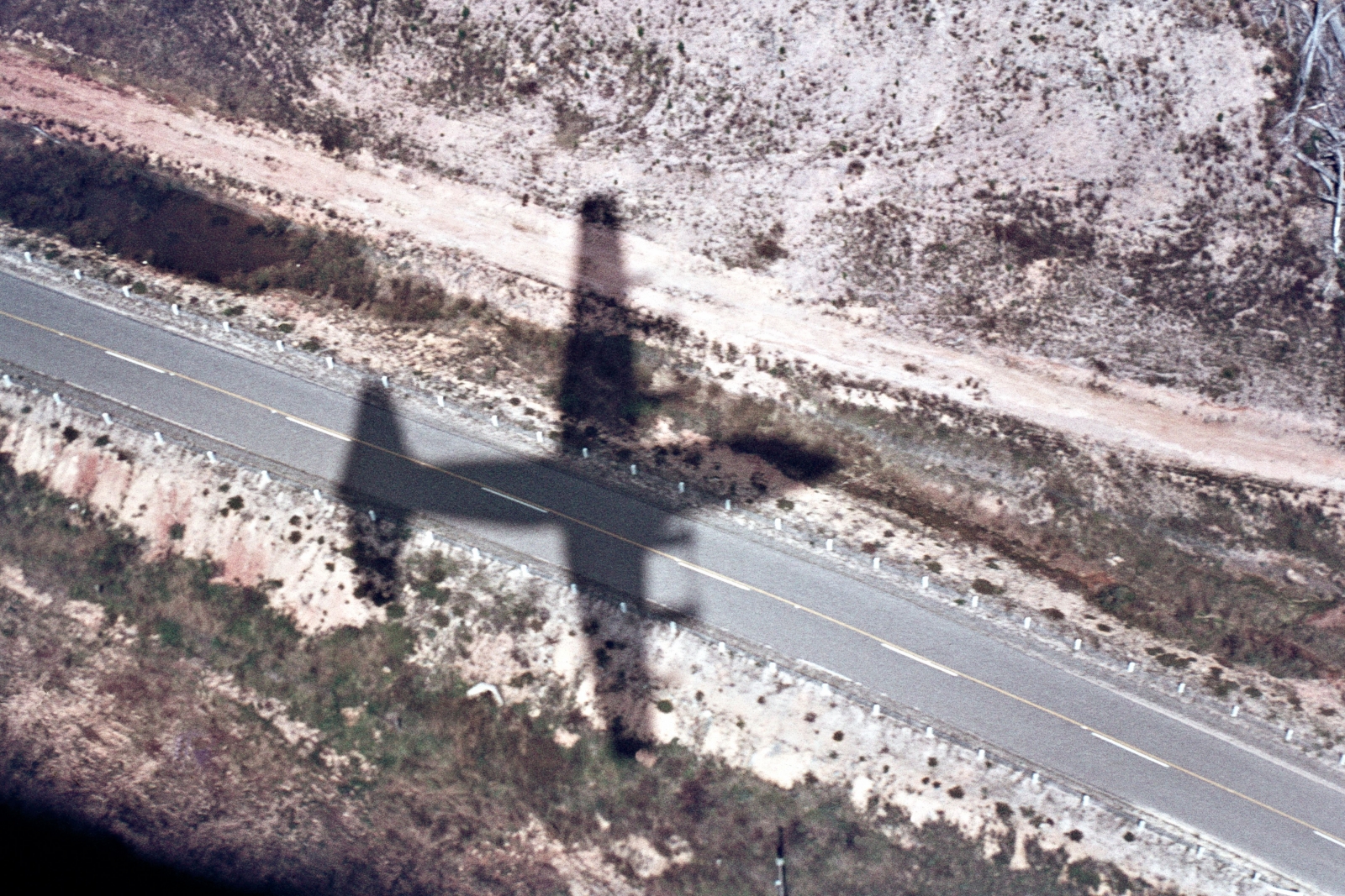 I.F.R. (I Follow Roads) - The aircraft's shadow taken from a low flying C130E during a training flight in the South Island of New Zealand.