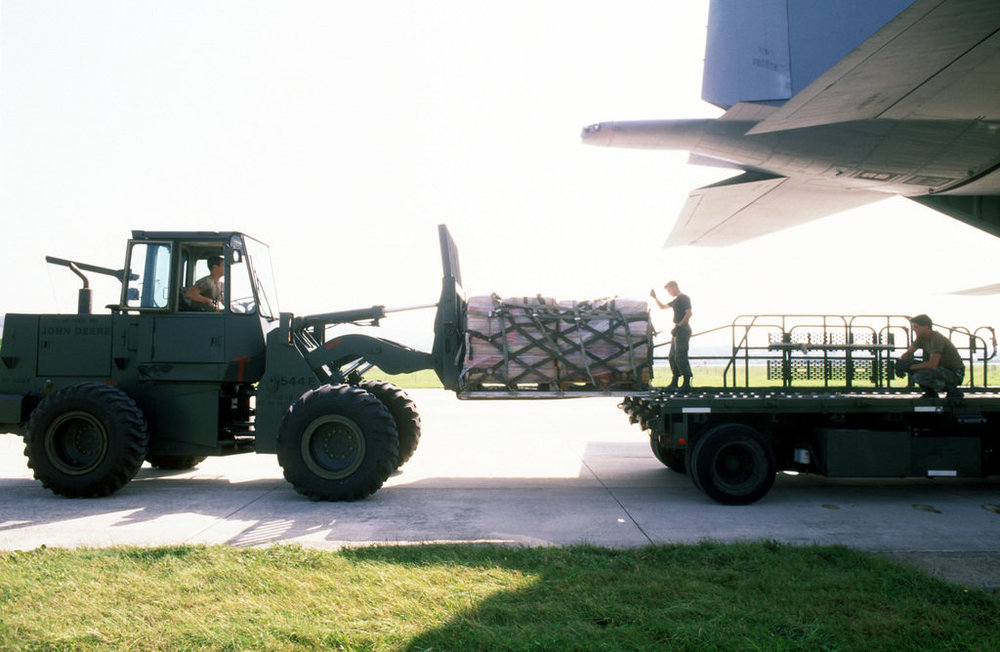 a-us-air-force-forklift-driver-moves-pallets-of-sacks-of-wheat-flour-in-preparation-c462dc-1024.jpg